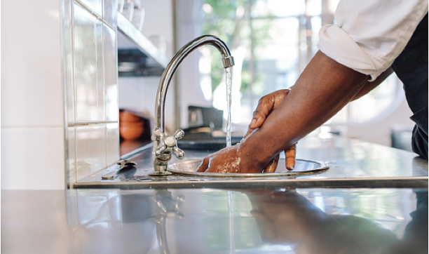 Washing hands in sink