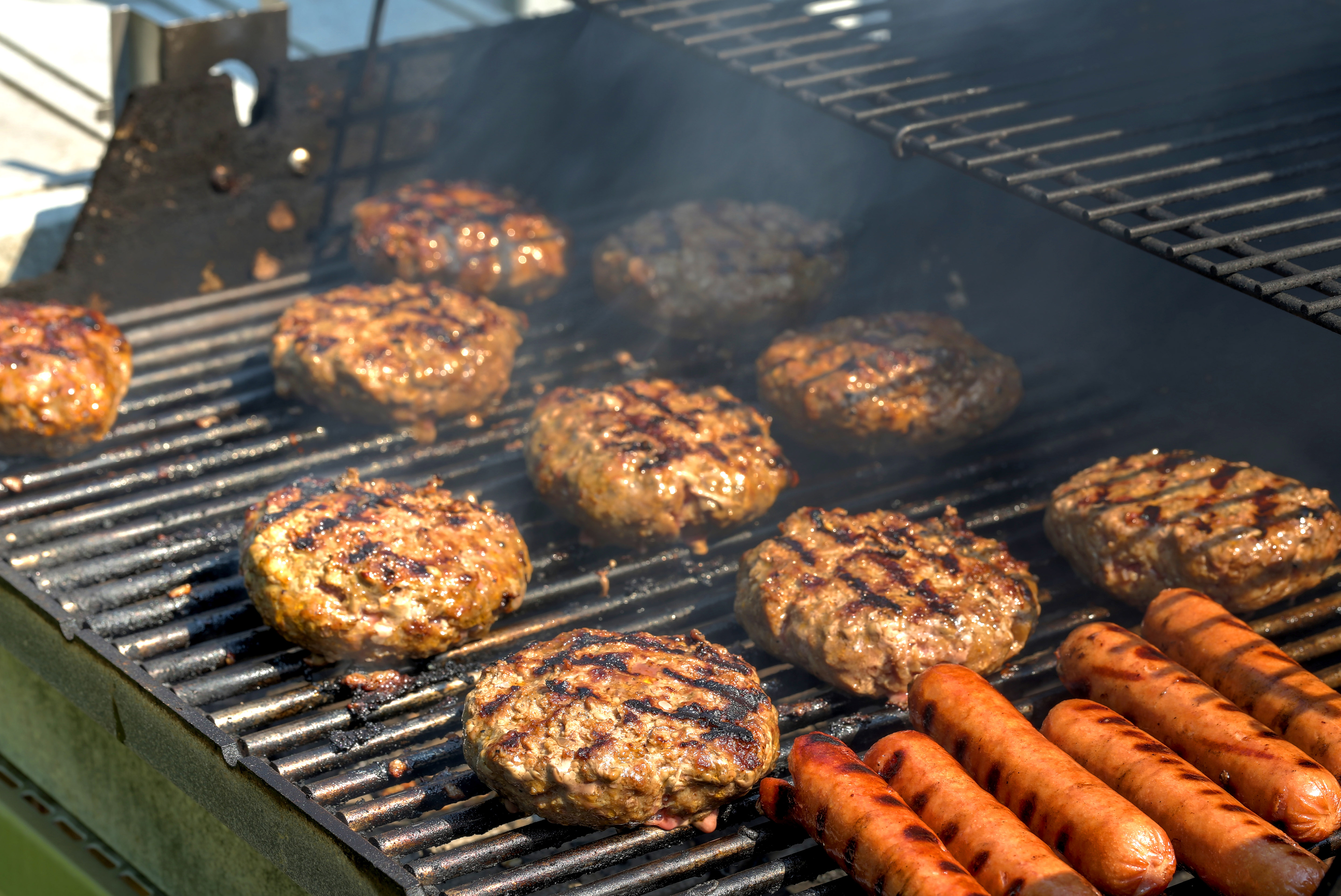 Burgers and hot dogs on a grill