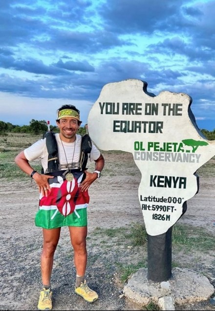 Dr. Jordán Saiz pictured on the equator during an ultramarathon in Kenya in September 2022. Photo by Kenyan park ranger.