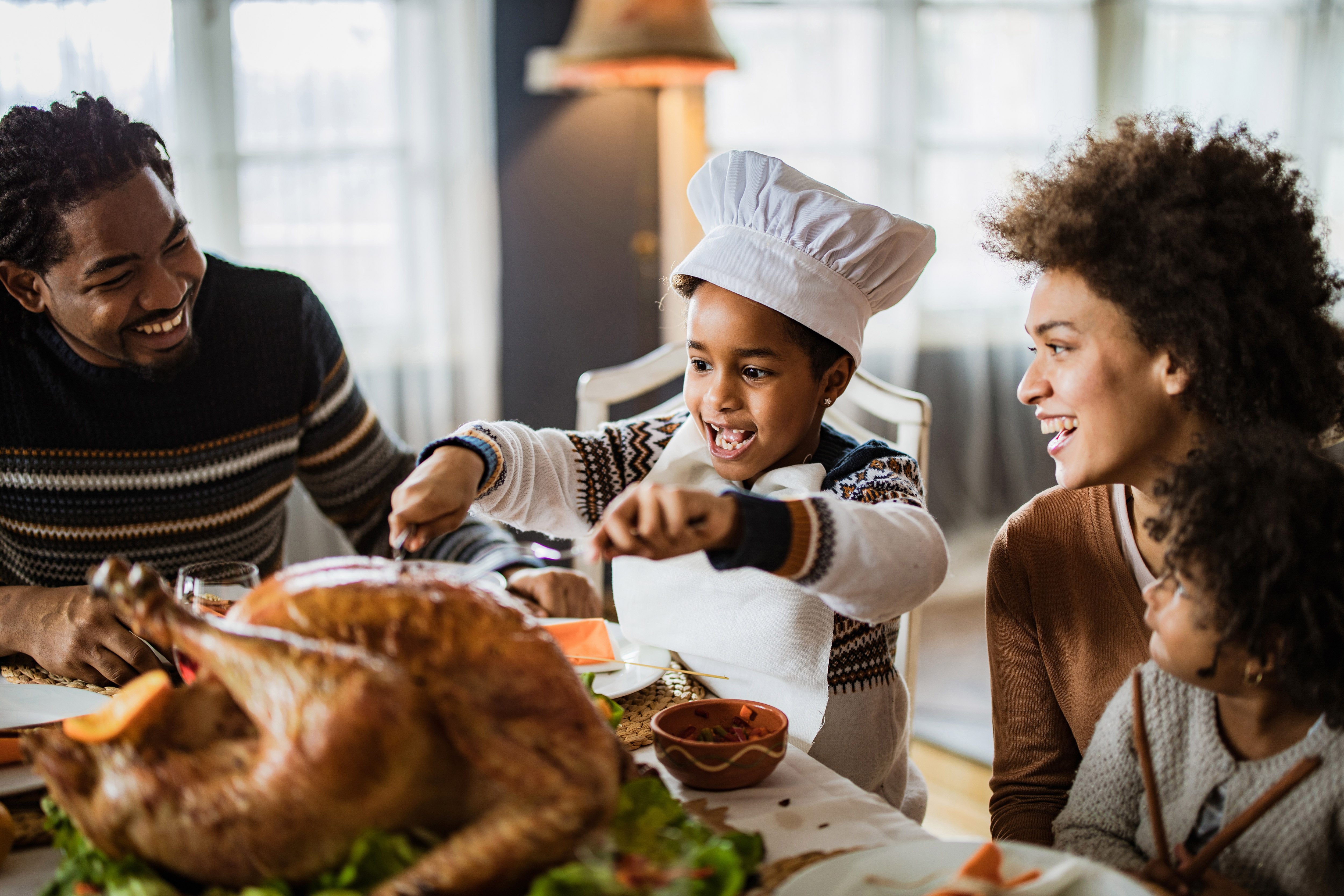 Family carving a turkey