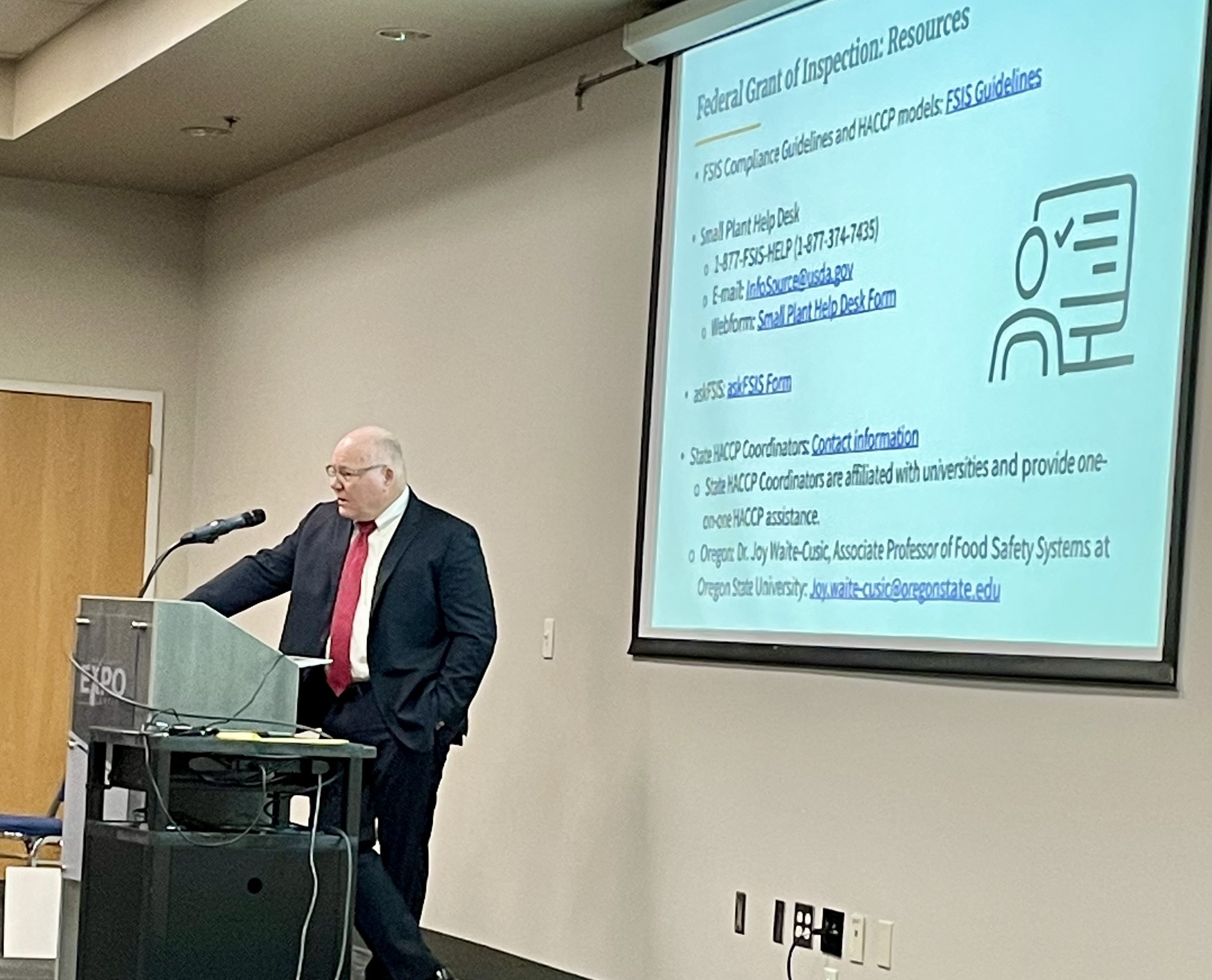 April-2024-Snapshot-Paul_Speaking_to_Small_Group.jpg