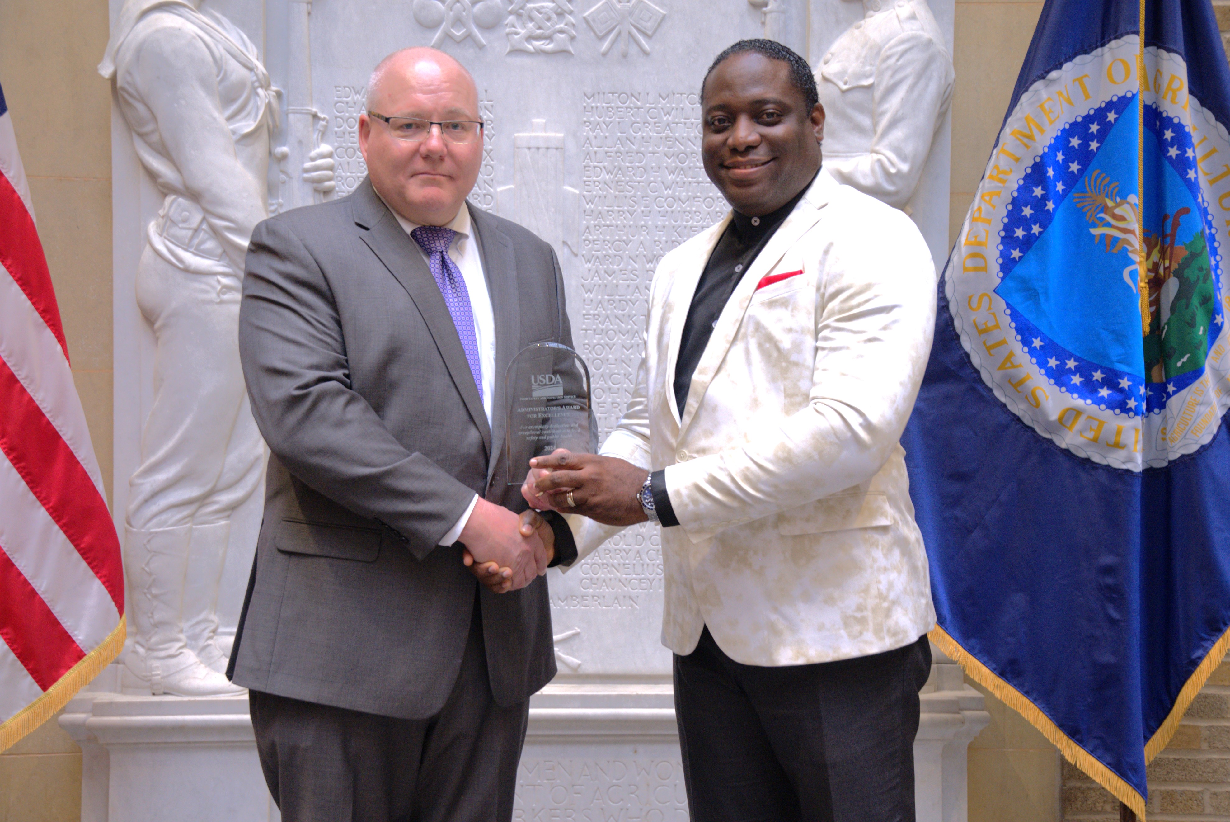 Administrator Paul Kiecker and Roland Ebegbe
