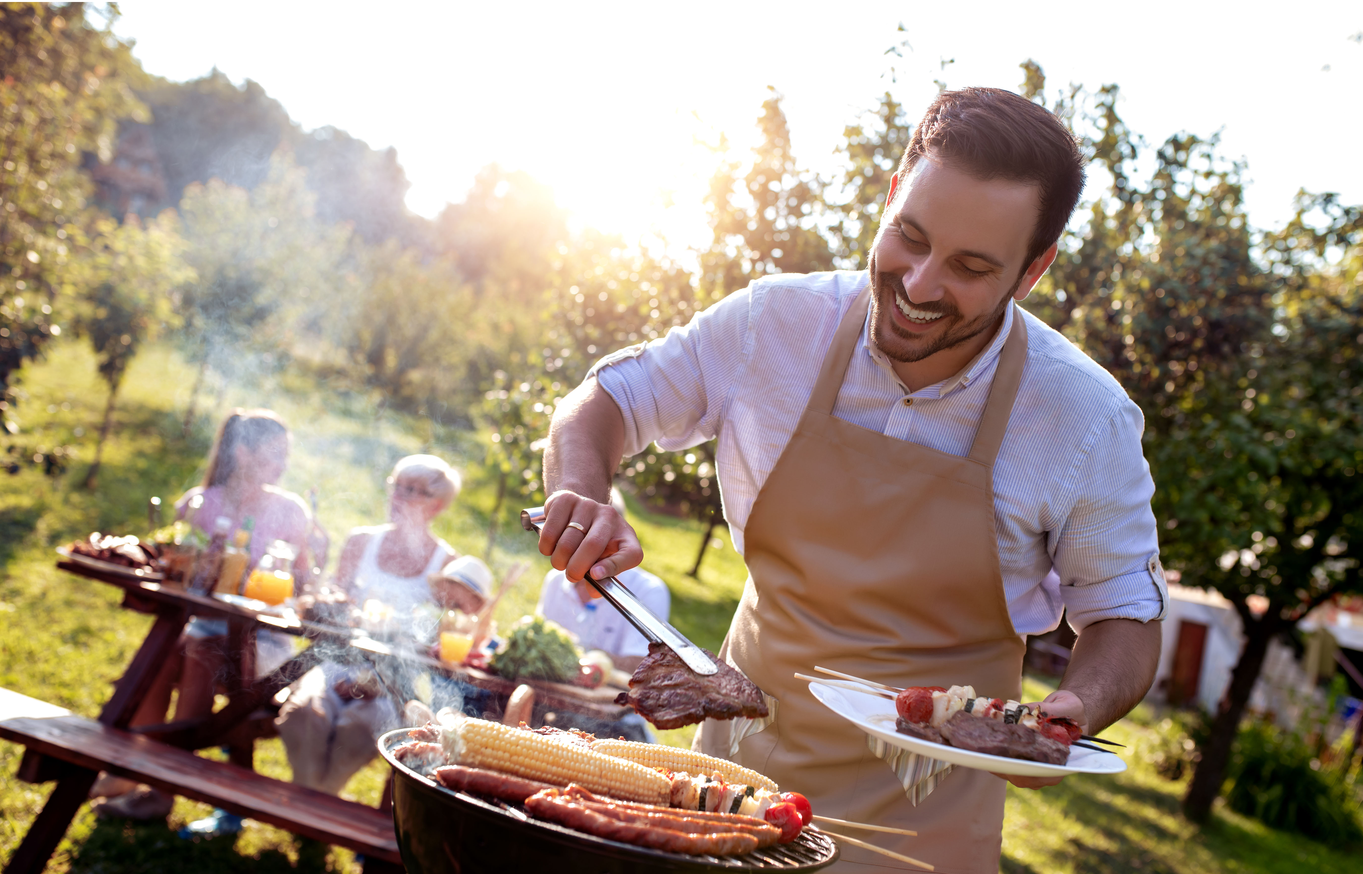 Man cooking food on an outdoor grill